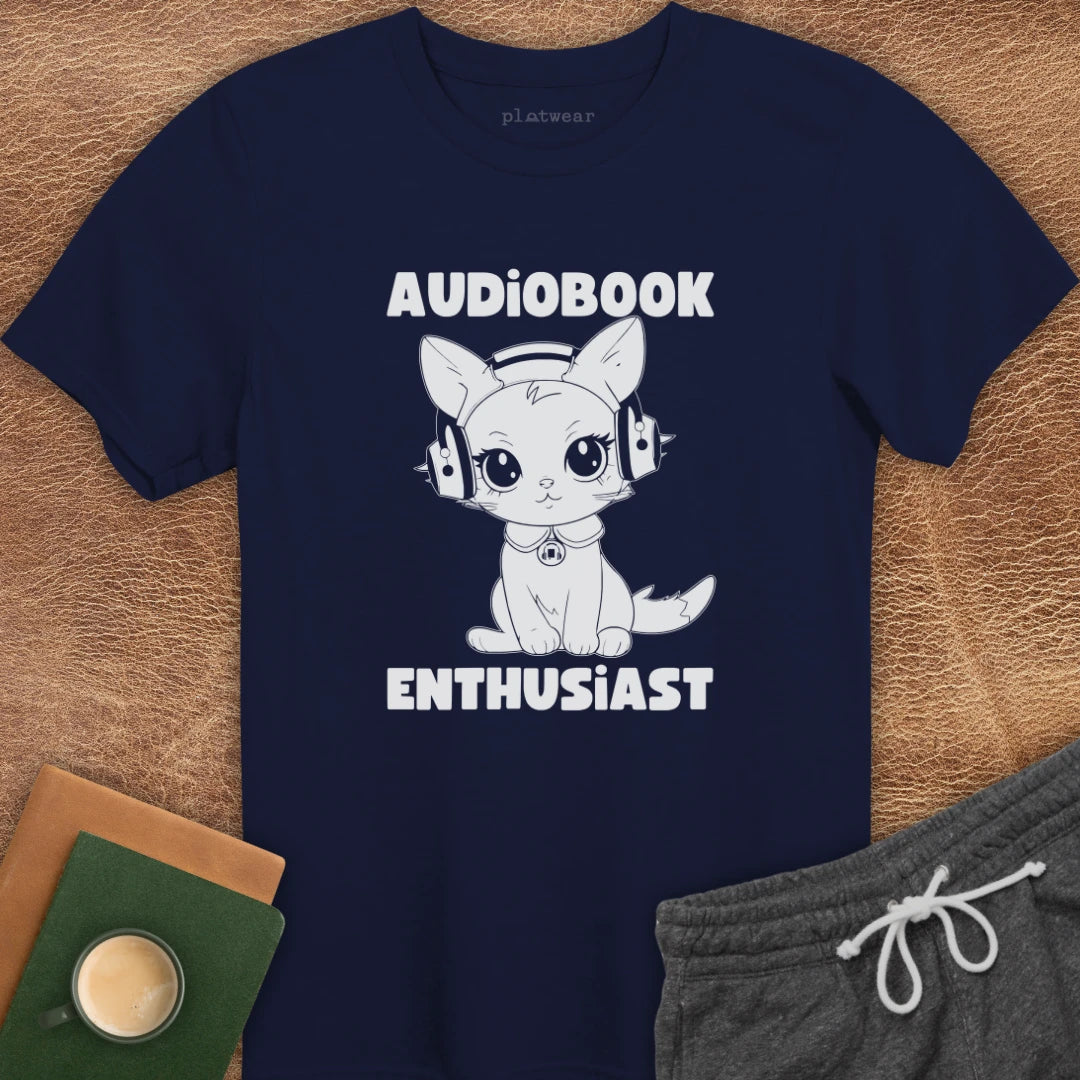 Black crew neck t-shirt with text 'AUDIOPBOOK ENTHUSIAST' and an illustration of a cat wearing headphones.