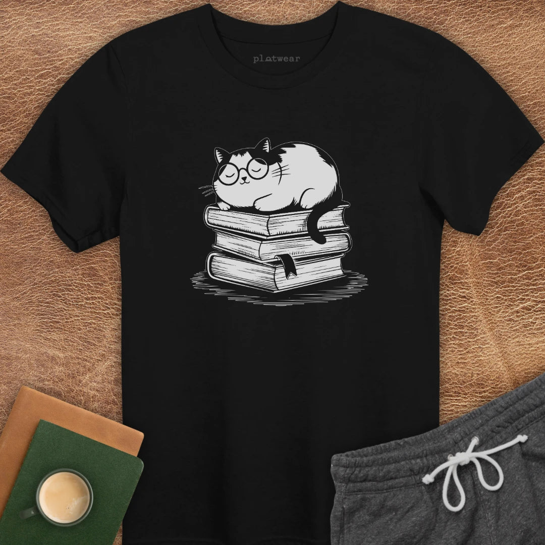 CAT SLEEPING ON BOOKS T-SHIRT