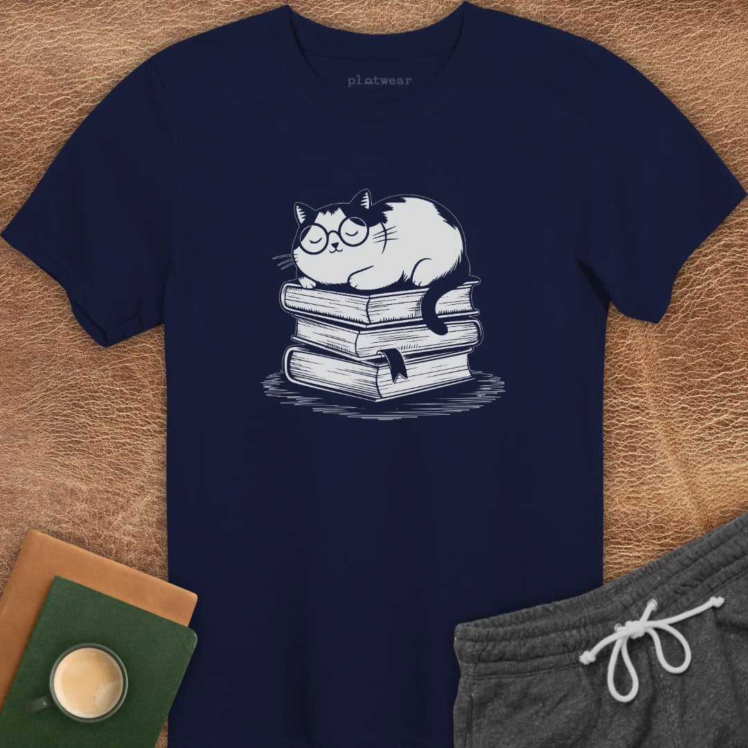CAT SLEEPING ON BOOKS T-SHIRT