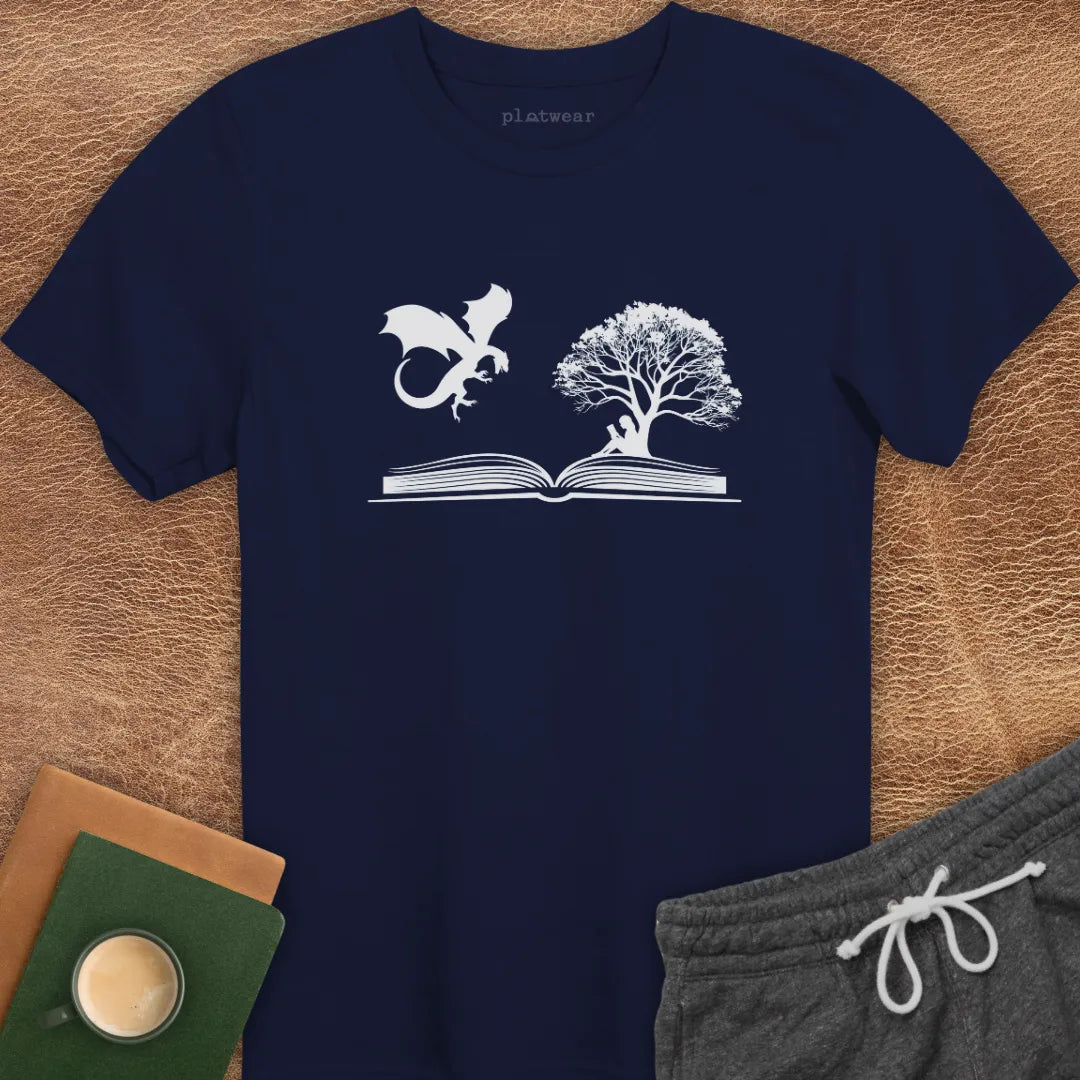 A dark green crew neck t-shirt with a graphic of a dragon and a tree on a open book printed on the front.