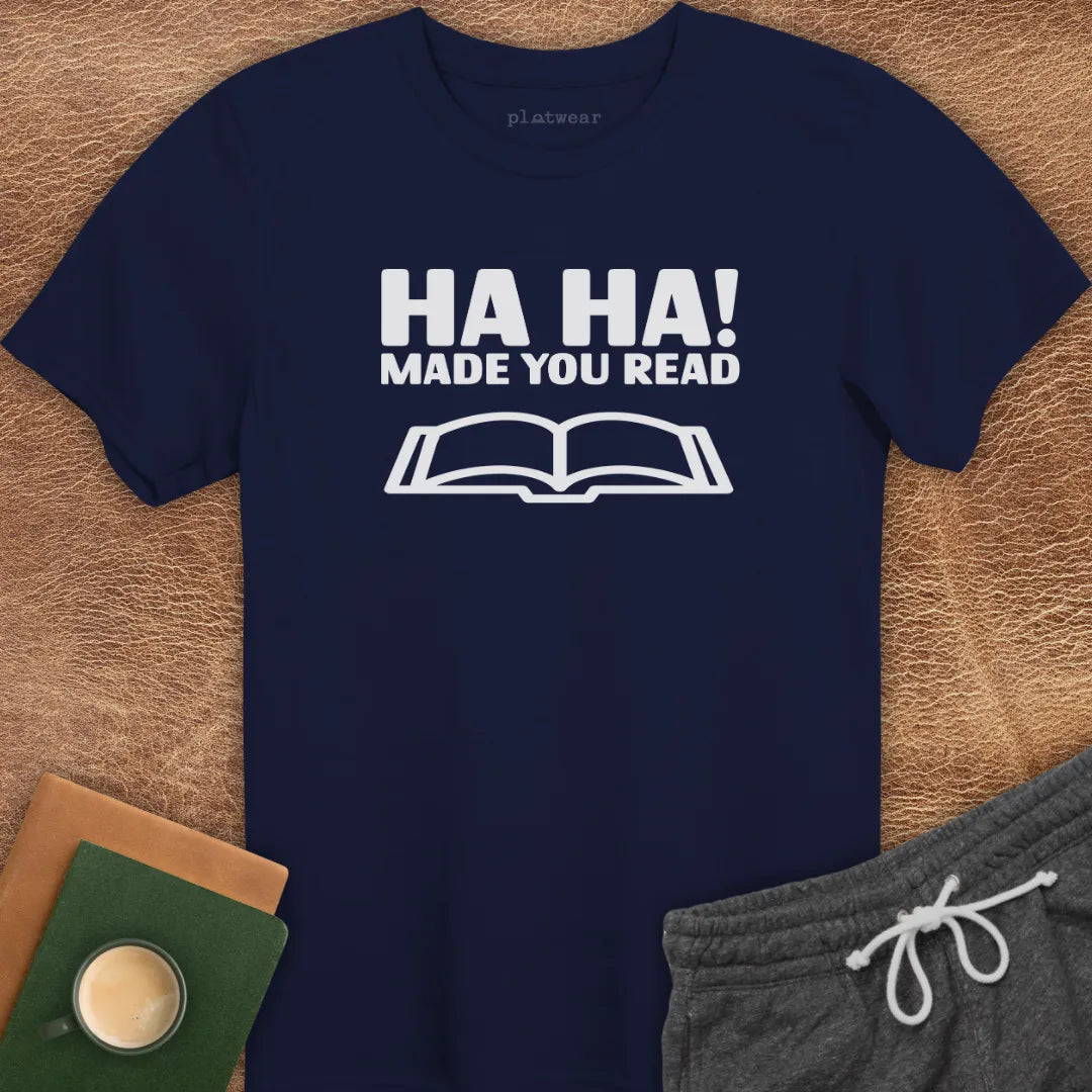 Maroon t-shirt with the text 'HA HA! MADE YOU READ' printed in white, accompanied by an image of an open book.