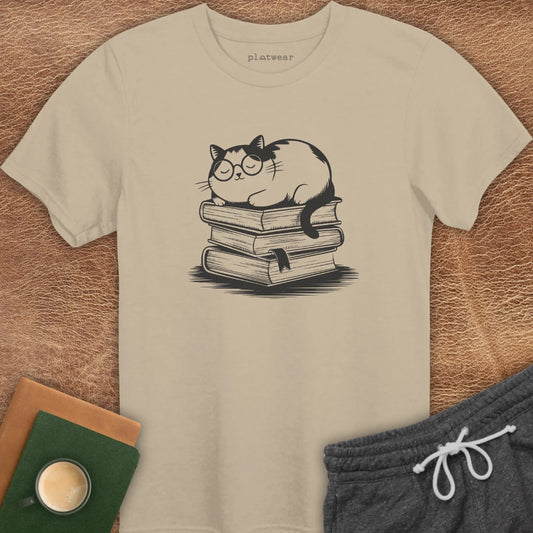 CAT SLEEPING ON BOOKS T-SHIRT